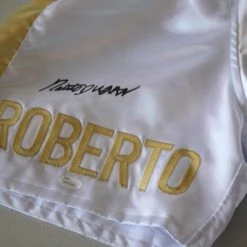 Iconsofboxing.com TOP FIGHTERS ROBERTO DURAN SIGNED GOLD BOXING TRUNKS "HAND OF STONE" JSA WITNESS PANAMA