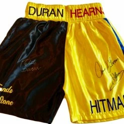 Iconsofboxing.com TOP FIGHTERS Roberto Duran Vs Tommy Hearns Custom Boxing Trunks Autographed In Silver Signature