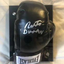 Iconsofboxing.com Roberto Duran Autographed Signed Everlast Blk/Silver Horizontal Boxing Gloves Display.